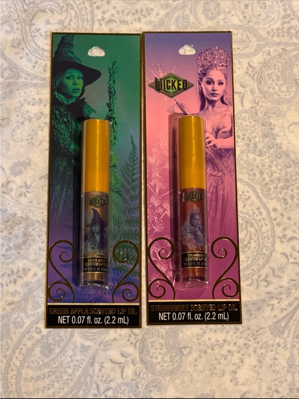 Wicked Scented Lip Oil Duo – Elphaba Green Apple & Glinda Strawberry